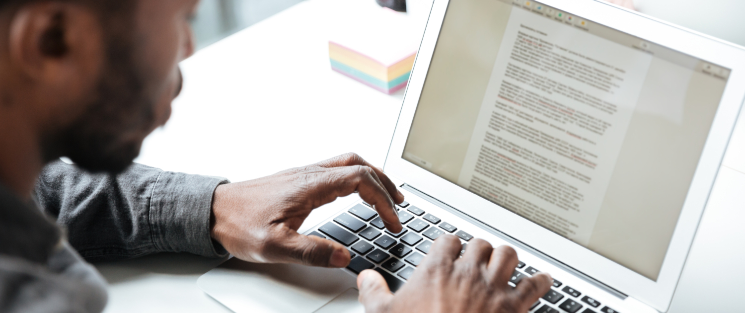 Cropped photo of serious young man sitting in office coworking